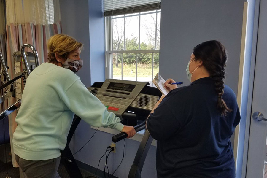 Christina monitoring a patient on a treadmill | La Plata Physical Therapy in La Plata, MD