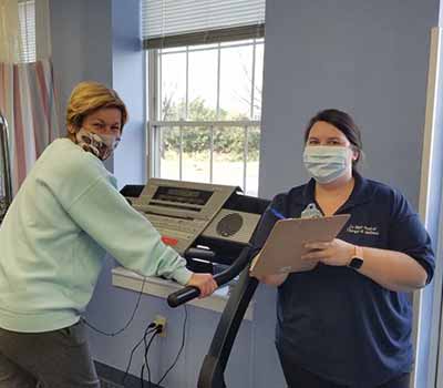 Christina working with a patient on a treadmill | La Plata Physical Therapy in La Plata, MD